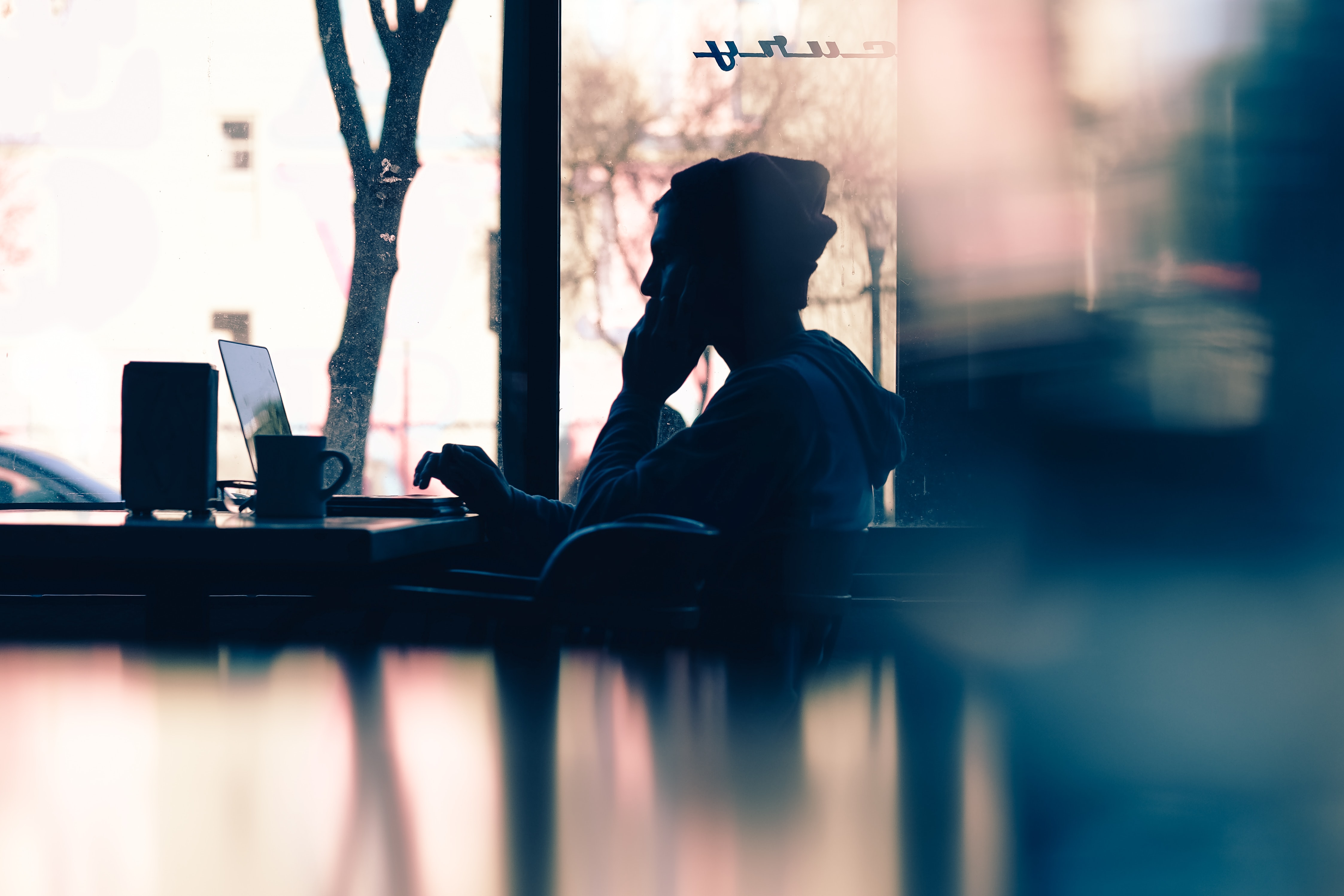 Photo by Hannah Wei on Unsplash person working on laptop